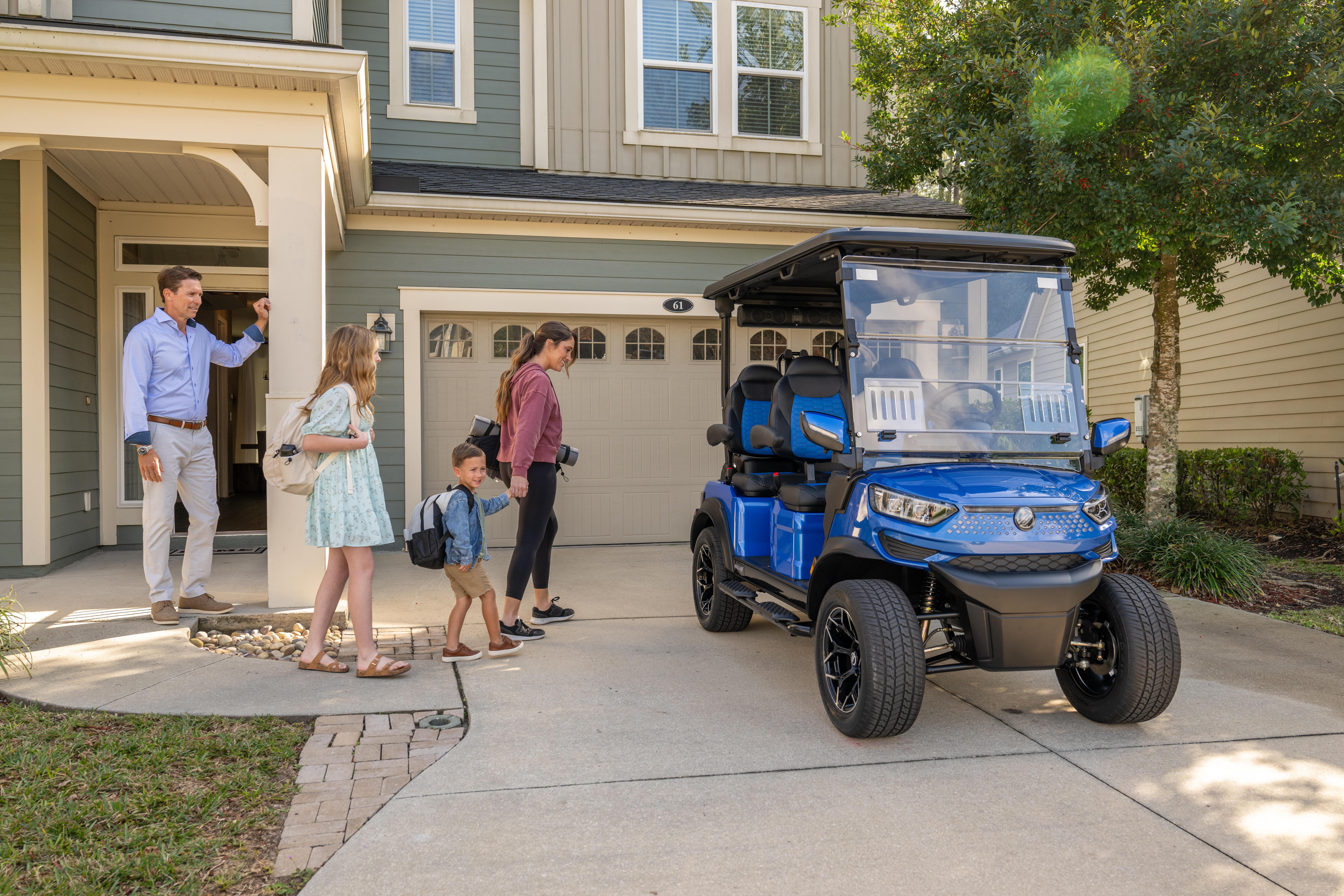 Family enjoying a golf cart powered by Bolt Lithium